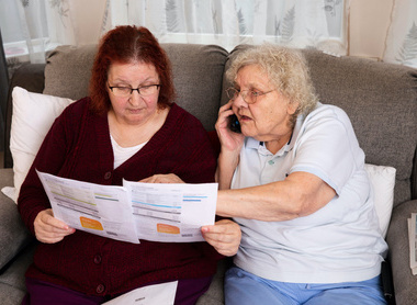 two ladies reading bill statement.jpg